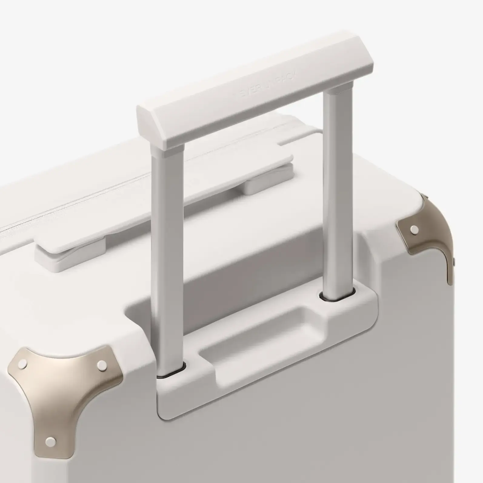 Beige carry-on luggage, The Cabin Trunk Essential by Armoir, telescopic handle detail